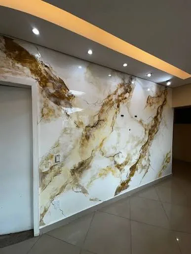 Cream and warm gold Calacatta marble effect in a luxury hallway
